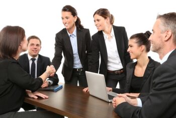 Office workers meeting around table