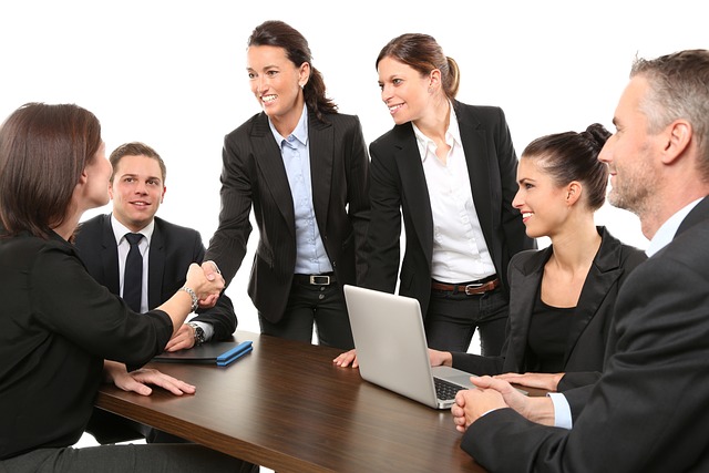 Office workers meeting around table