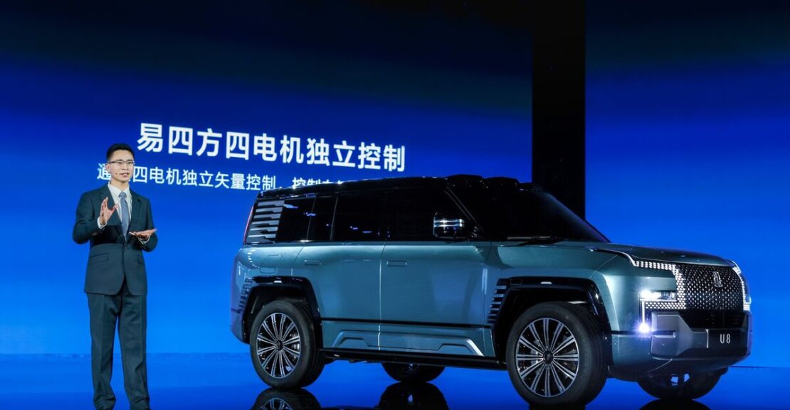 a byd electric car and presenter at an promotional event