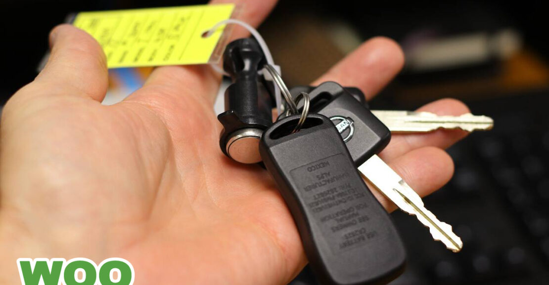image of a set of car keys in a hand.