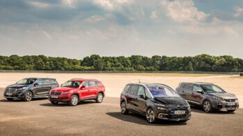 small selection of MPV cars parked outside