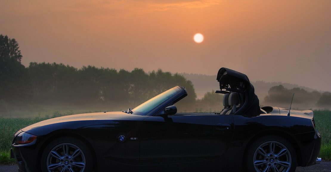 BMW z4 two-seater car with the sunset in background
