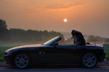 BMW z4 two-seater car with the sunset in background