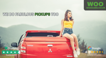 image of a woman sitting on the back of a pickup truck
