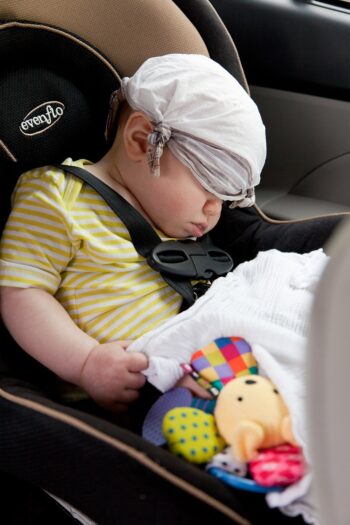 Baby sleeping inside a car