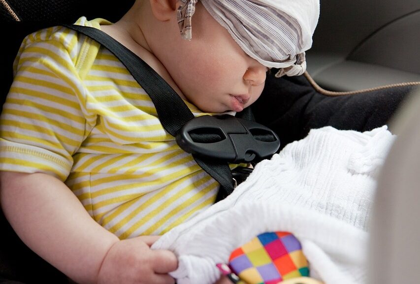 Baby sleeping inside a car