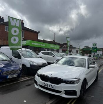 white bmw parked on road